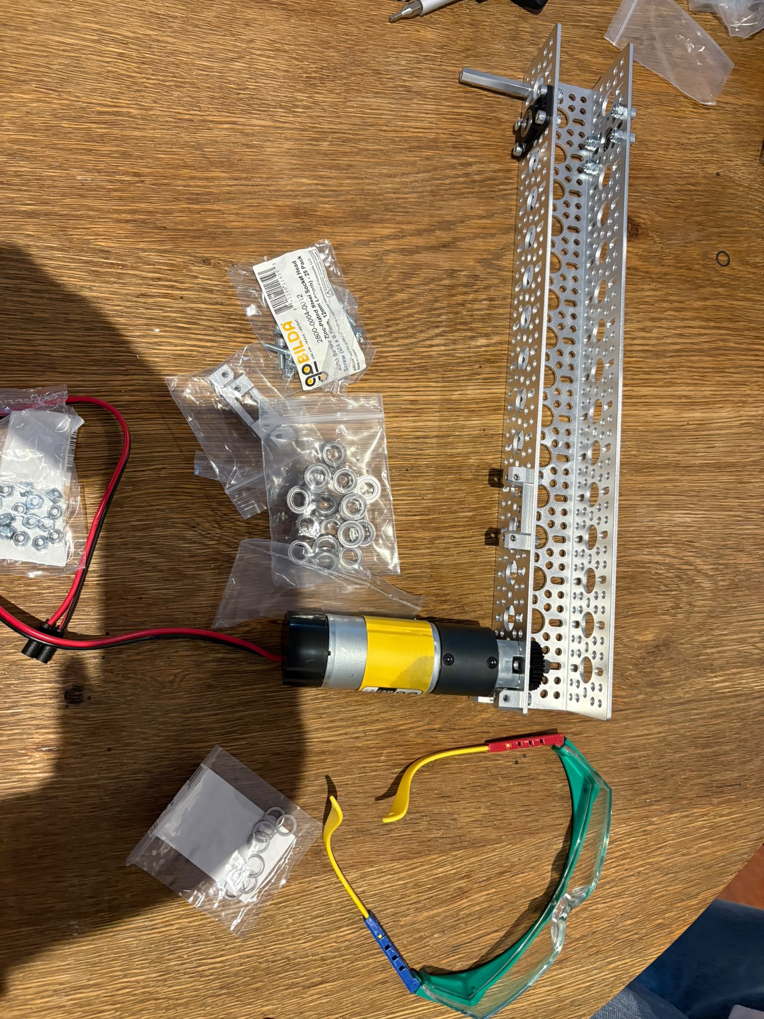 Team assembling goBILDA drivetrain with motors and wiring